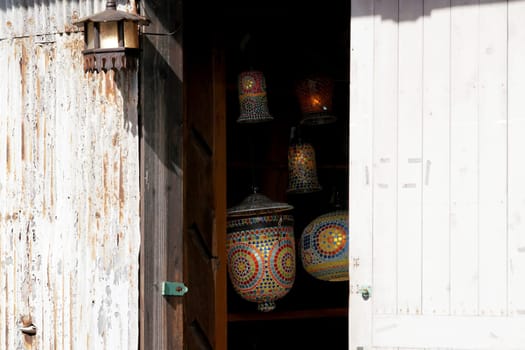 old colorful lamps hanging house entrance, street lighting