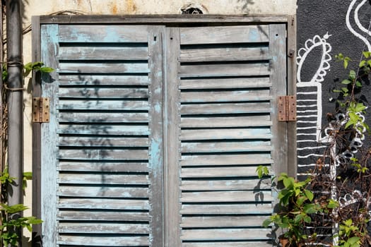 Old weathered wooden door for background or texture