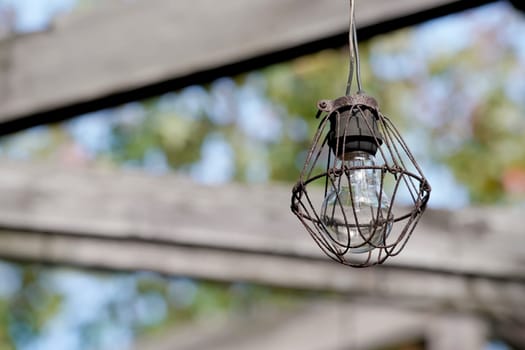 Dirty old light bulb in abandoned barn