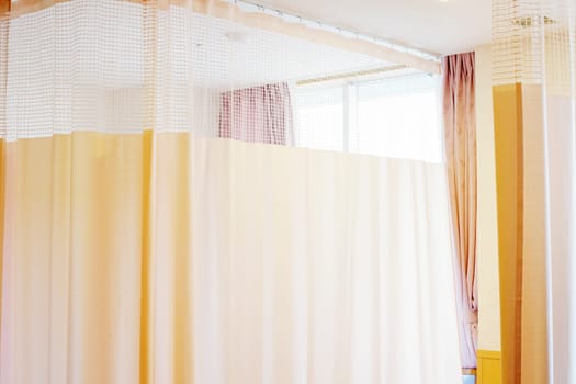 Medical curtain hanging from a railing in a hospital room, Privacy curtain