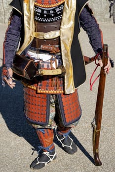 Japanese samurai clothing yoroi and kabuto uniform with old rifle