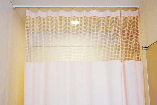 Medical curtain hanging from a railing in a hospital room, Privacy curtain