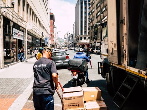 Cape Town, South Africa, February 9, 2018: Unloading delivery truck in downtown Cape Town, South Africa