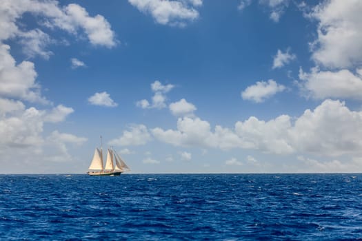 Sailboat on a bright sunny day in an open sea in British Virgin Islands