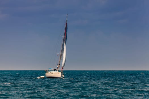 Sailboat on a bright sunny day in an open sea in British Virgin Islands