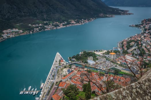 Homes and houses in Kotor town and stunning landscape of the Bay of Kotor, as seen from the trail to the fortress above town, Montenegro