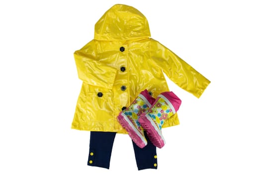 Fashion for rain season. Girls elegant yellow rain jacket and a pair colorful rubber boots isolated on a white background. Close-up.