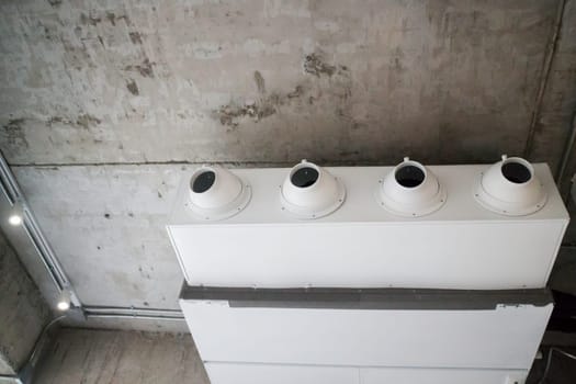White air conditioner in loft room, stock photo