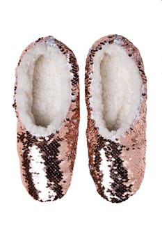 Slippers isolated. A pair golden glossy house slipper with fur isolated on a white background. Woman shoes.