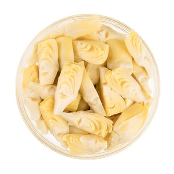 Quartered artichoke hearts isolated on white background and viewed from above.