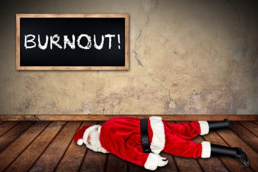 red white santa claus overworked frustration burnout concept lying on wooden floor with blackboard concrete wall interior room