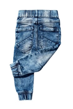 Blue jeans trousers isolated on white background. Fashionable jeans for child boy. Right trouser leg folded. Top view on back.