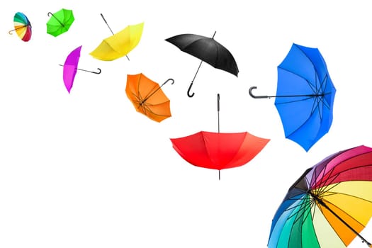 flying umbrellas in front of white background