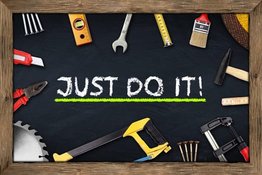 tools on just do it blackboard with wooden frame