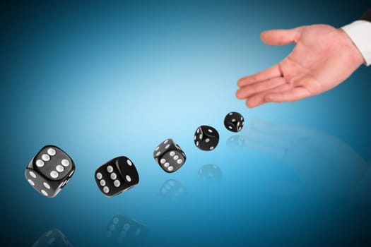 dices rolling out of a hand