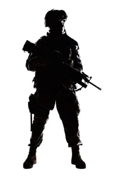 Full length, low key studio shoot of fully equipped army soldier in camo uniform and helmet, armed with pistol and assault service rifle with underbarrel grenade launcher isolated on white background