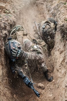 Paratroopers of french 1st Marine Infantry Parachute Regiment RPIMA are shelled in threnches, contused, covered with earth and soil