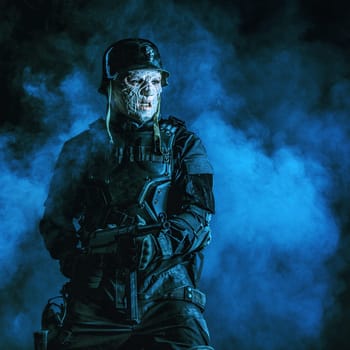 Ugly face of Futuristic nazi soldier in gas mask and steel helmet. Skin burned by atomic flame