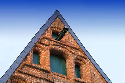 Typical gable of buildings in Lüneburg, Germany, with pulley blue sky and copy space