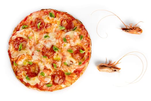 Pizza with shrimps and salami on white background with two shrimps heads near