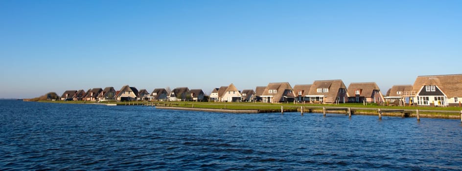 Holiday homes on the waterfront in Friesland, the Netherlands.