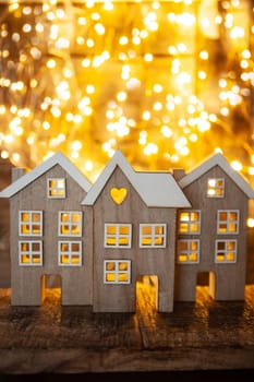 Little wooden houses in front of cozy bokeh lights