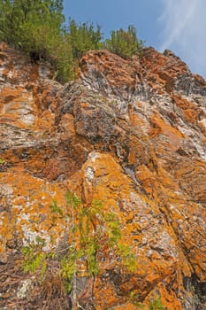 Looking up at Dramatic Orange Cliffs on Ottertrack Lake in Quetico Provincial Park in Ontario
