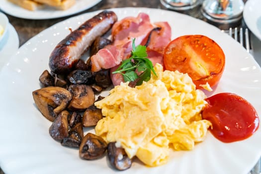 Full English Breakfast on Table with coffee