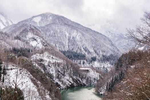 Train in Winter landscape snow on bridge