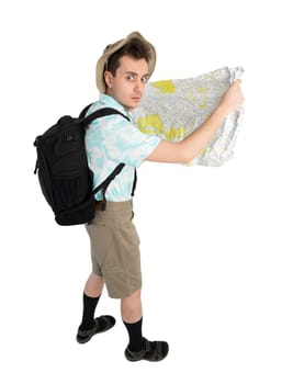 Worried man tourist in blue shirt, brown shorts and hat with backpack on his shoulders holding map. Traveler looking route and going to interesting tour. Isolated on white background.