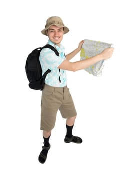 Happy man tourist in blue shirt, brown shorts and hat with backpack on his shoulders holding map. Traveler smiling and going to interesting tour. Isolated on white background.