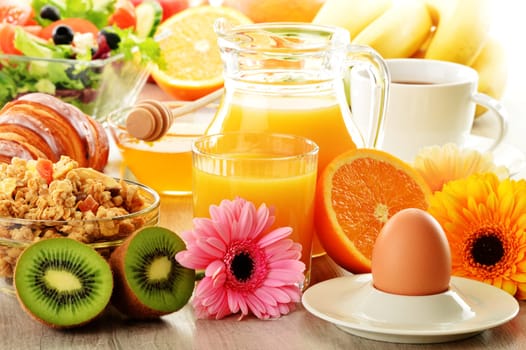 Breakfast with coffee, juice, croissant, salad, muesli and egg. Swedish buffet