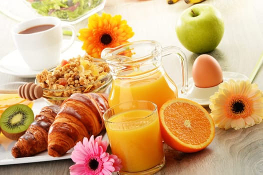 Breakfast with coffee, juice, croissant, salad, muesli and egg. Swedish buffet