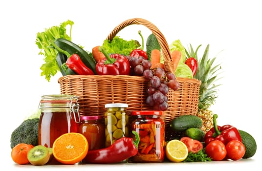 Wicker basket with groceries isolated on white background