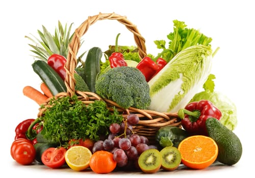 Wicker basket with groceries isolated on white background