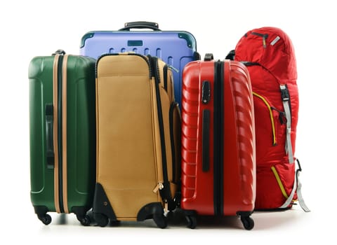 Luggage consisting of large suitcases and rucksack isolated on white.