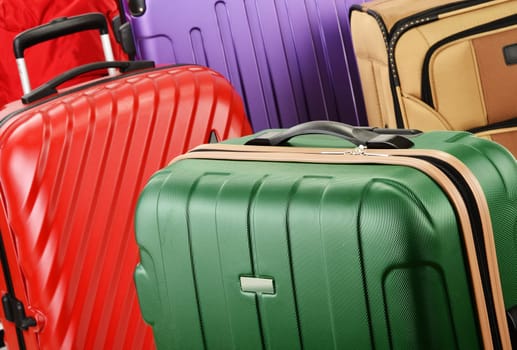 Composition with colorful travel suitcases.
