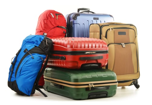 Luggage consisting of large suitcases and rucksack isolated on white.