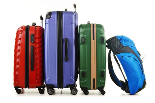 Luggage consisting of large suitcases and rucksack isolated on white.