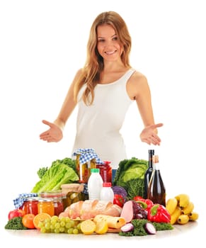 Young woman with assorted grocery products isolated on white background