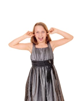A beautiful young girl standing for white background with her hands.in her ears and showing her thong..
