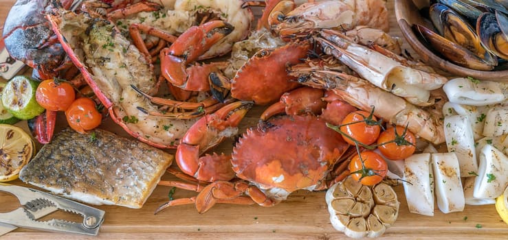 groumet seafood platter on wooden plate