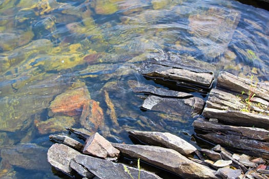 Split rocks along a waters edge of the Canadian Shield.