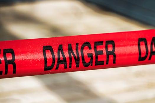 Closeup of red danger tape.