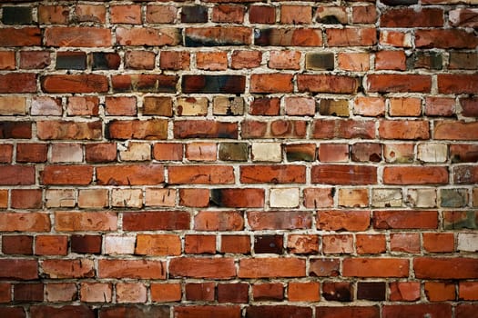 Old red brickwall texture with broken bricks