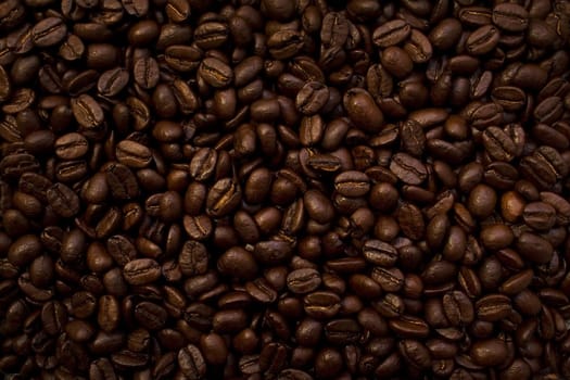 brown roasted coffee beans background in studio