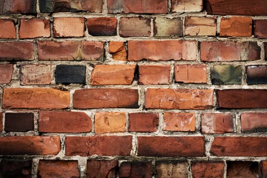 Old red brickwall texture with broken bricks