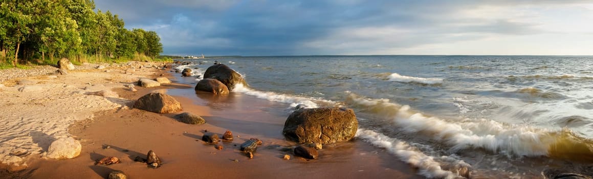 Panoramic view to beach with rocks and waves