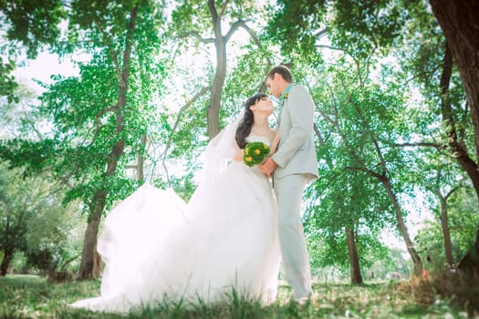 Married Couple in forest embracing
