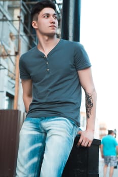 Young attractive man in urban background